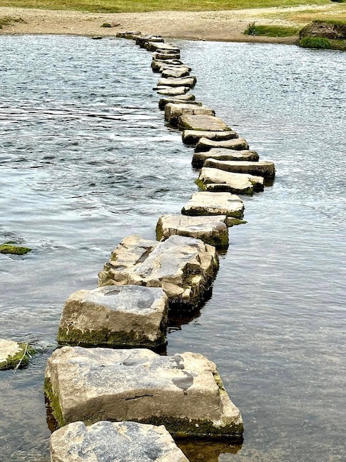 A stone path across a river.